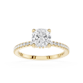 Gold ring with a large diamond and smaller diamonds on the band against a white background