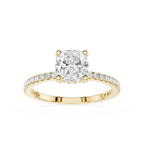 Gold ring with a large diamond and smaller diamonds on the band against a white background