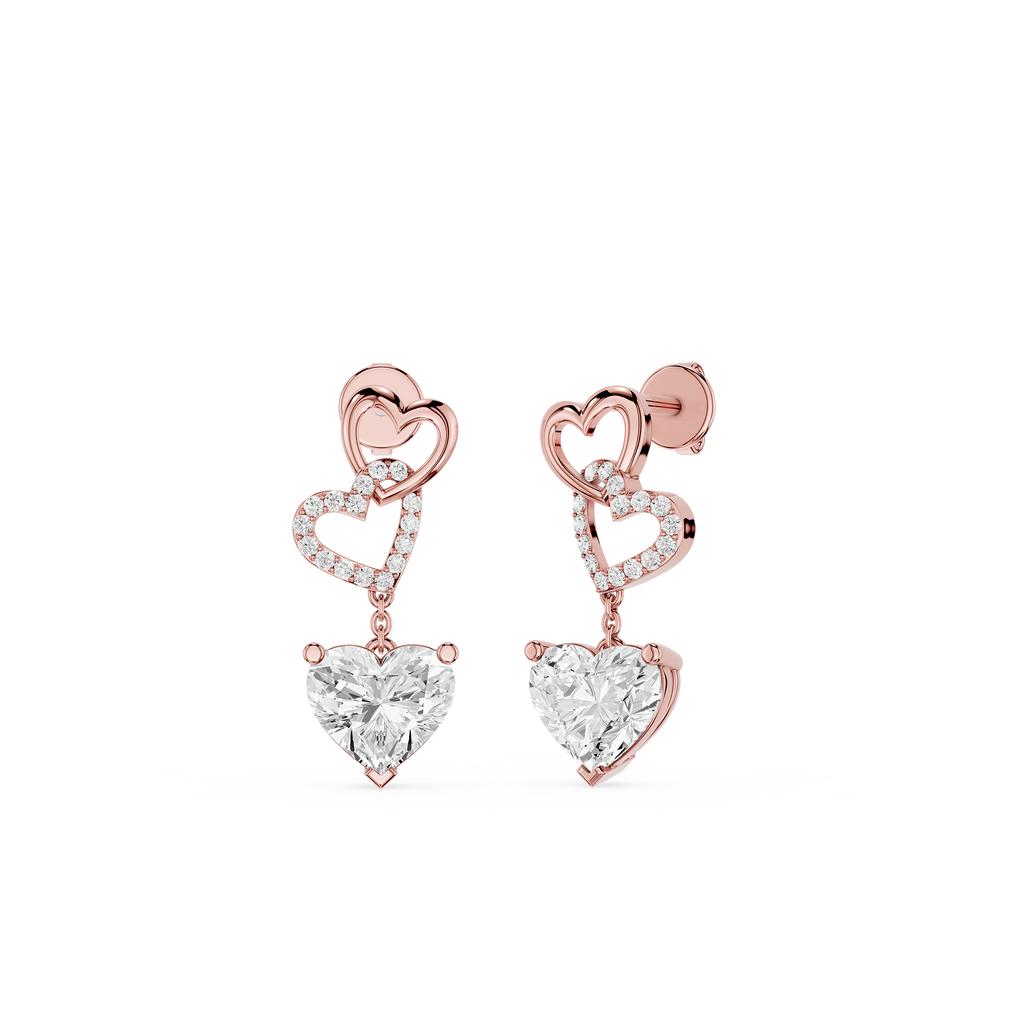 Rose gold heart-shaped earrings with clear gemstones on a white background