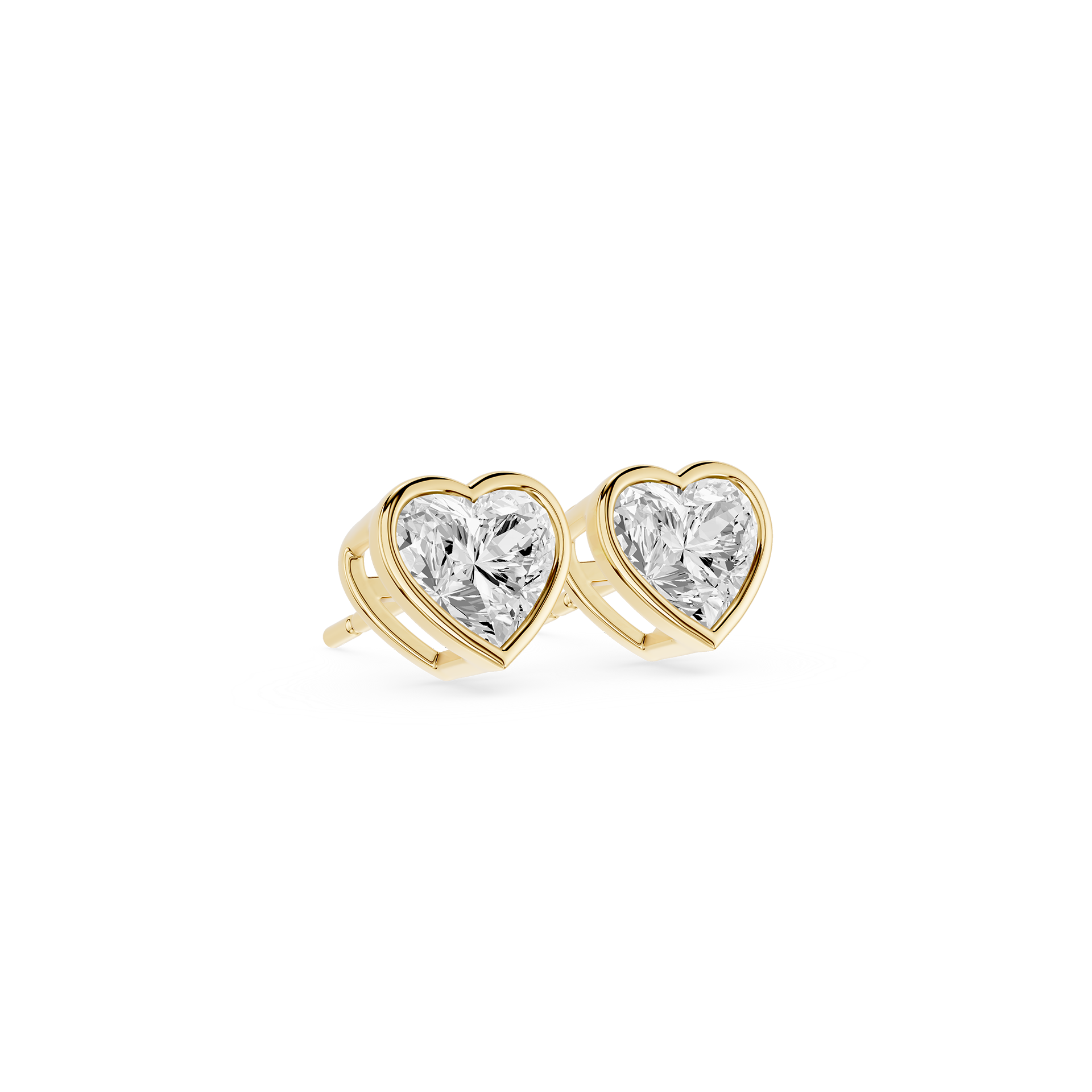 Heart-shaped diamond earrings with gold settings on a white background