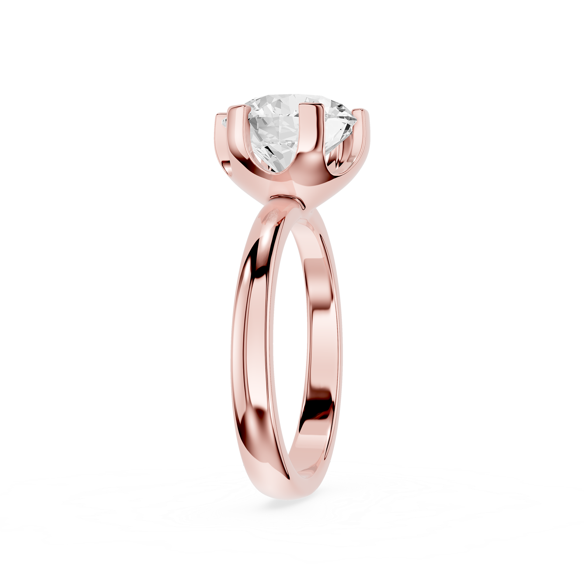 Rose gold ring with a clear gemstone on a white background