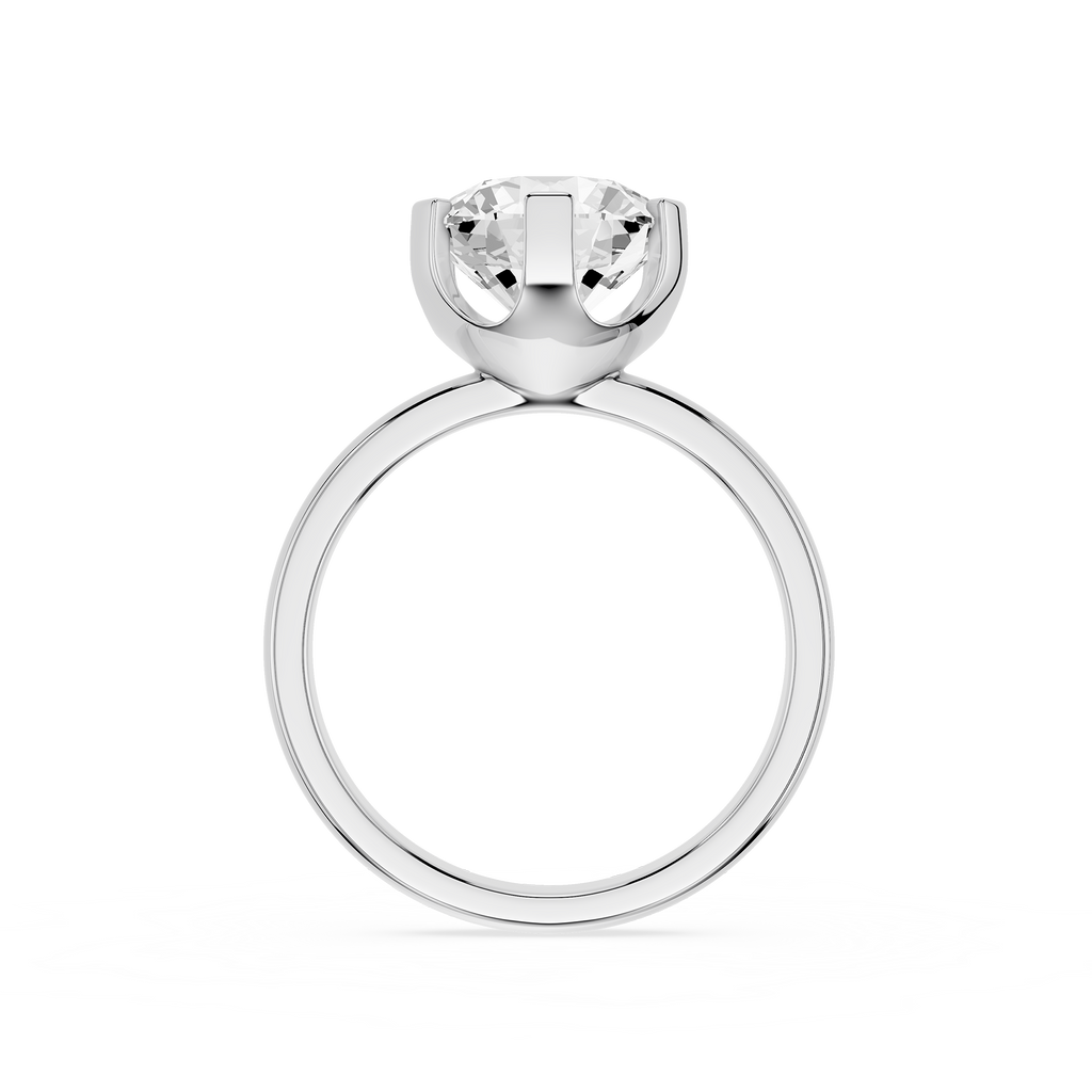 Silver ring with a clear gemstone on a white background