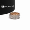 A bold rose gold diamond statement ring with a wide domed band, closely set round diamonds and rectangular diamond details