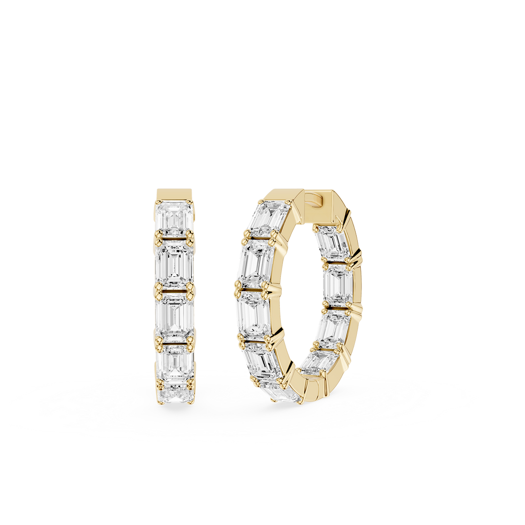 Gold hoop earrings with clear gemstones on a white background