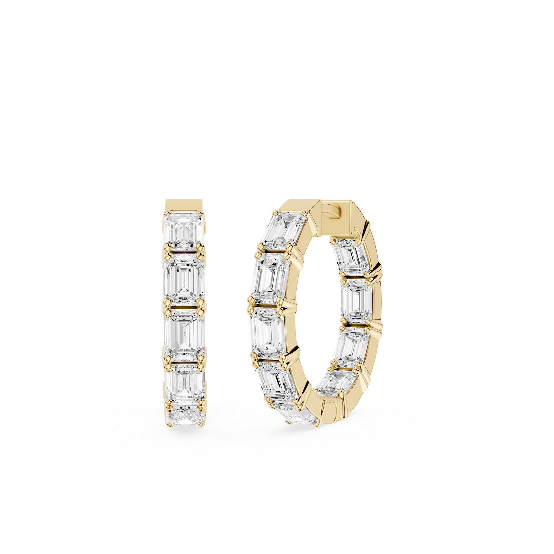 Gold hoop earrings with clear gemstones on a white background