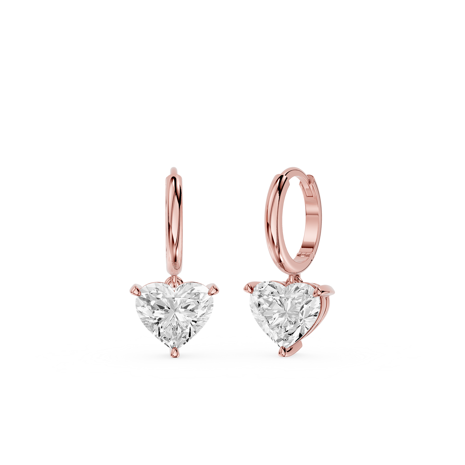 Rose gold hoop earrings with heart-shaped clear gemstones on a white background