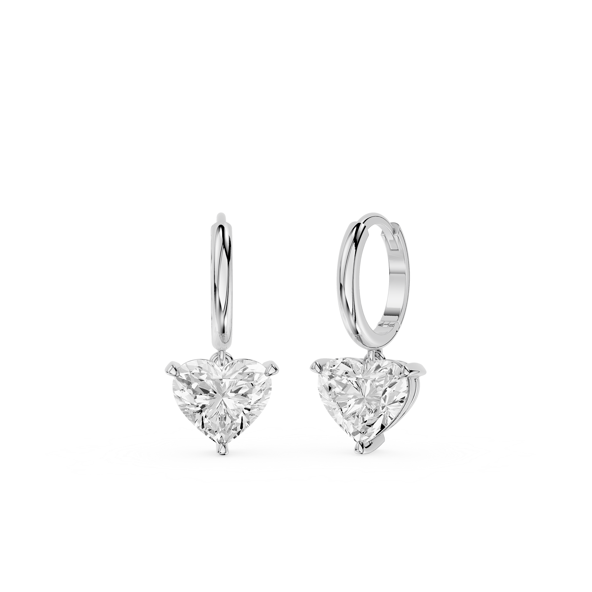 Pair of silver hoop earrings with heart-shaped clear gemstones on a white background