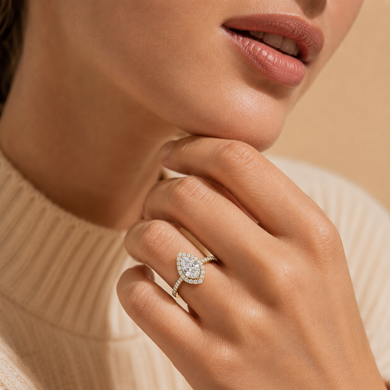 Close-up of a hand wearing a diamond ring with a soft focus background