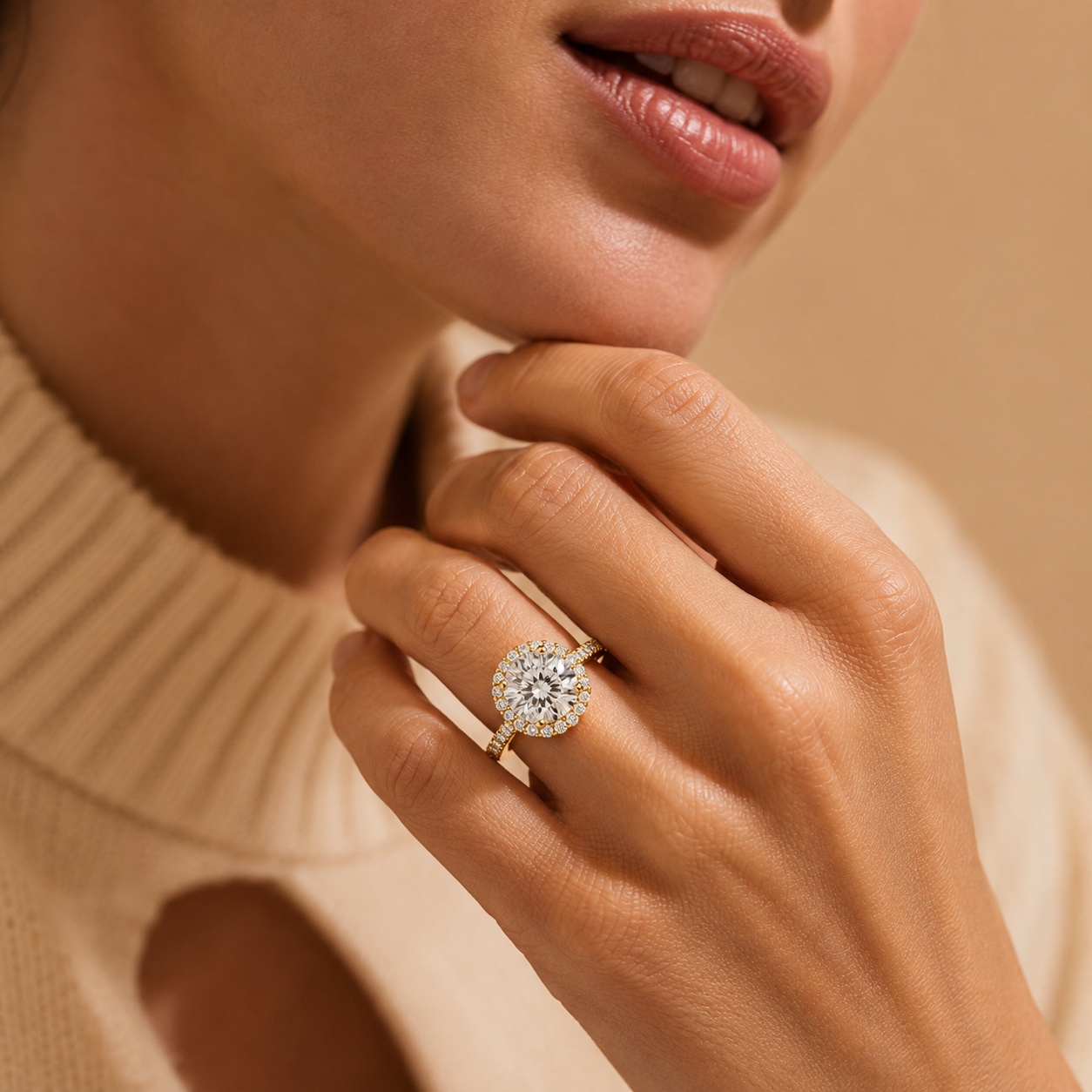 Close-up of a hand wearing a diamond ring with a neutral background
