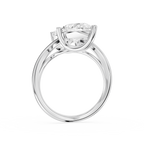 Prong set pear cut lab diamonds meet at the center of this white gold bypass ring with a sculpted curved band