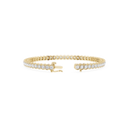 Gold bracelet with anchor charm on a white background