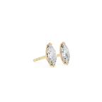 Gold earrings with clear gemstones on a white background