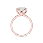 Rose gold ring with a clear gemstone on a white background