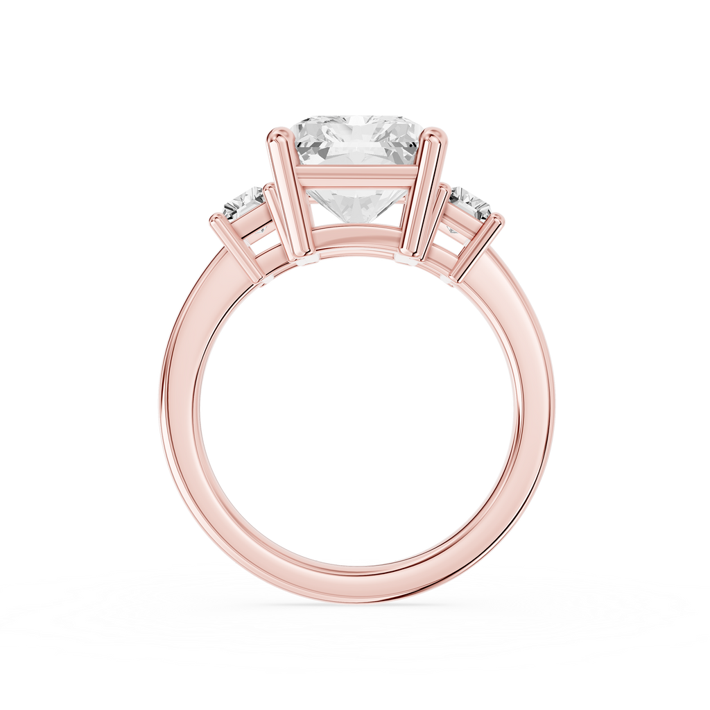 A large radiant cut lab diamond rests between two baguette side diamonds on this rose gold ring with a polished shank