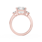 A large radiant cut lab diamond rests between two baguette side diamonds on this rose gold ring with a polished shank