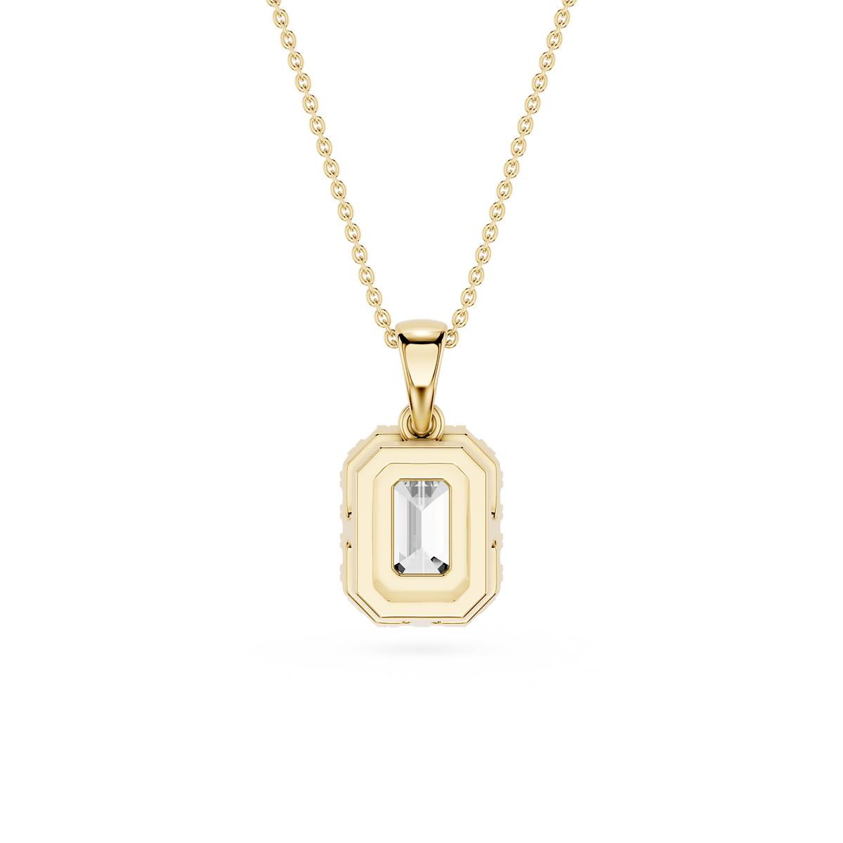 Gold pendant necklace with a clear gemstone on a white background