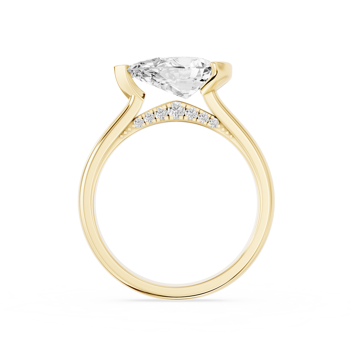 A pear cut diamond sits sideways across this yellow gold engagement ring, secured by an asymmetrical partial bezel setting