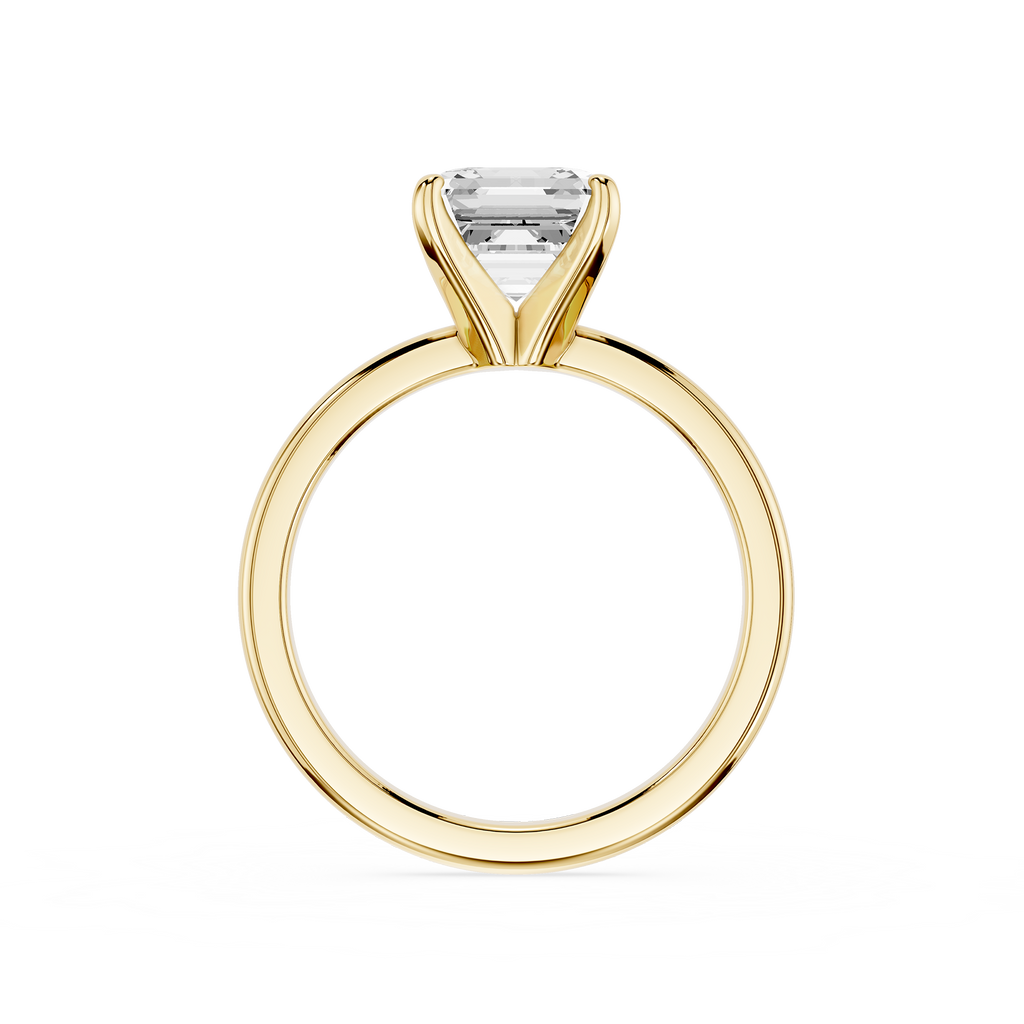 Gold ring with a clear gemstone on a white background