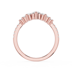 Rose gold ring with small diamonds on a white background