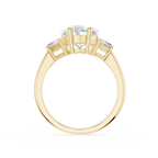 Gold ring with a central diamond and two smaller diamonds on a white background