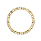 A yellow gold eternity ring featuring a continuous line of round-cut clear gemstones in a prong setting, shown against a plain white background.