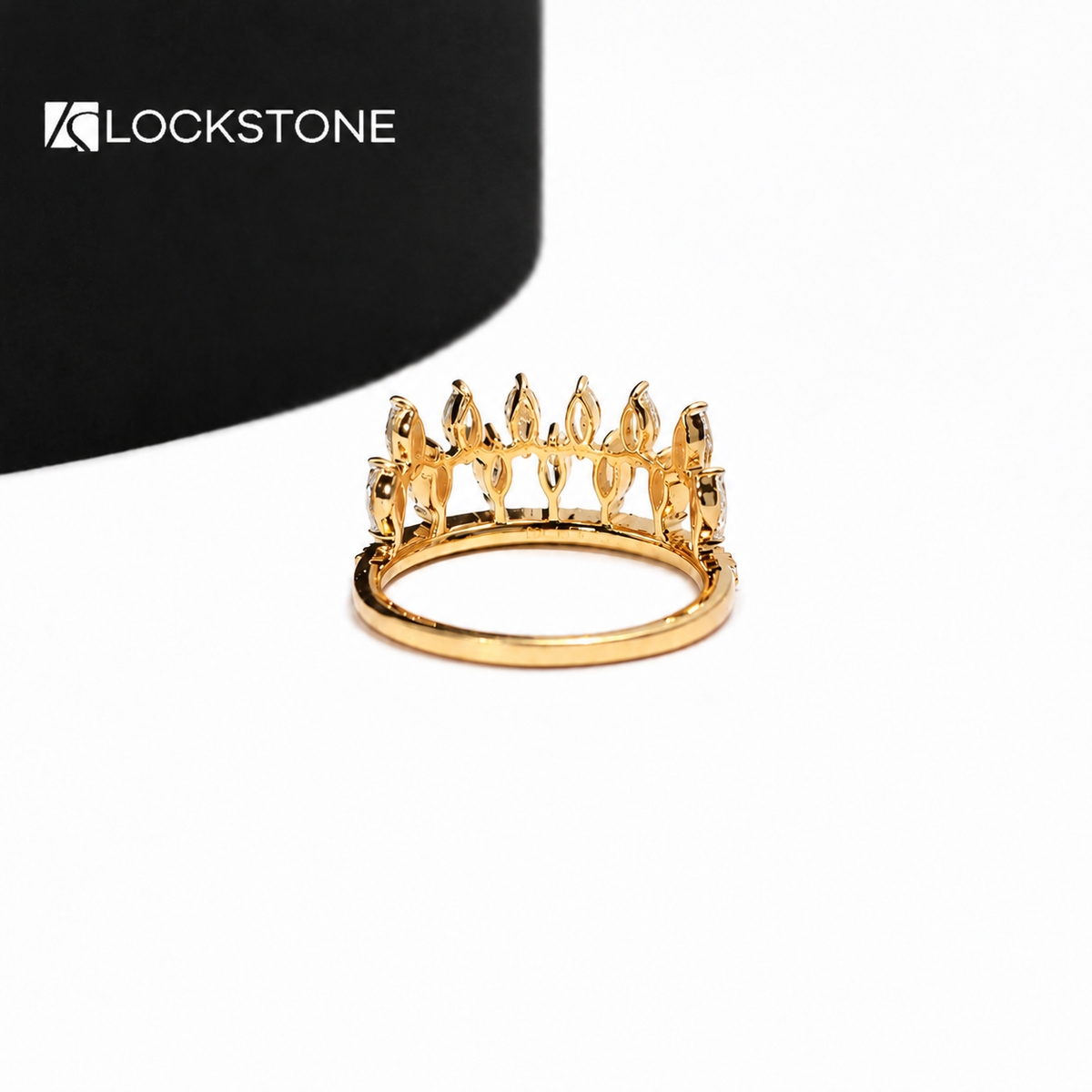 Yellow gold diamond tiara ring displaying prong set marquise diamonds in an openwork design with a row of round accent stones