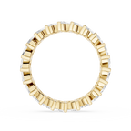 Gold ring with diamond accents on a white background