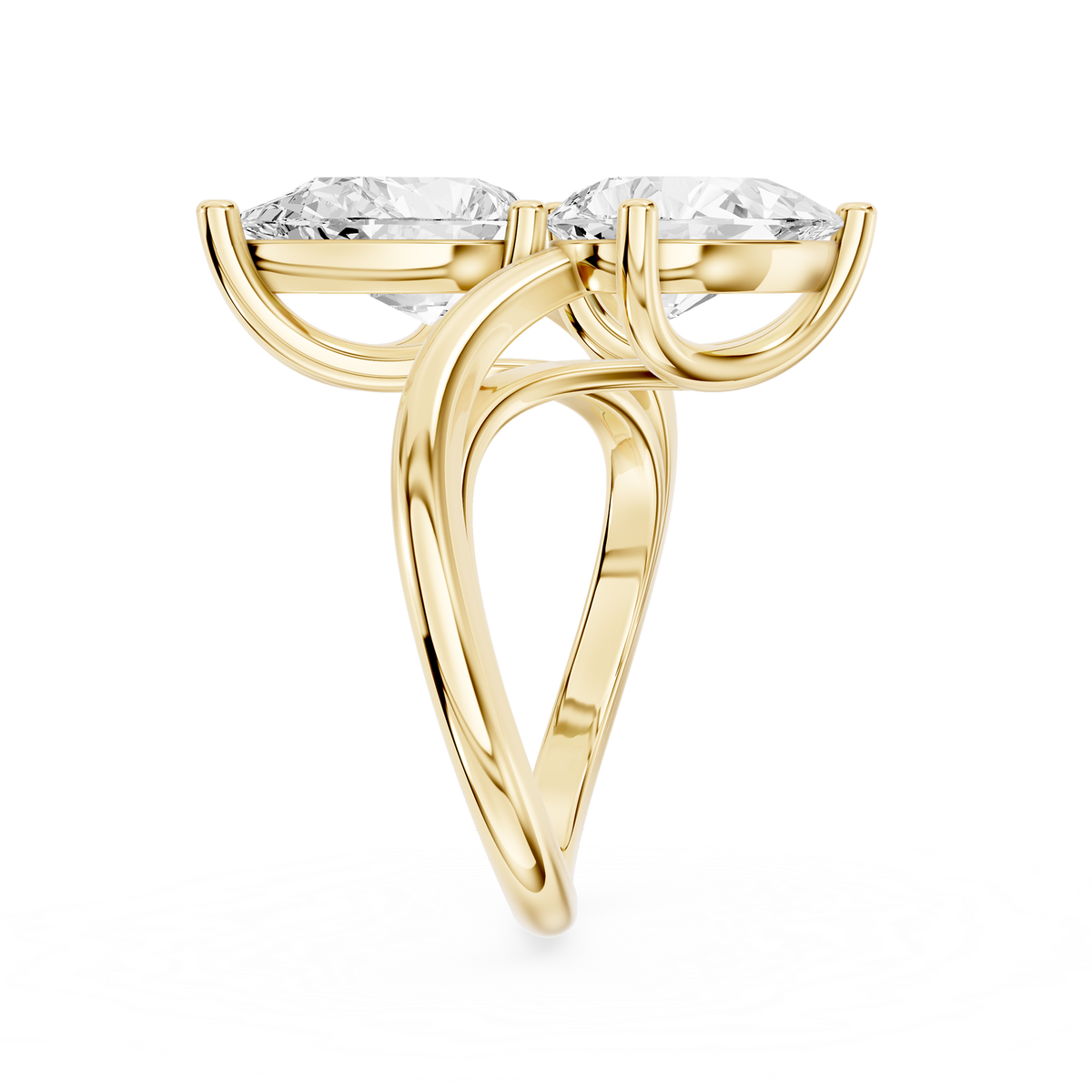 Two pear shaped lab diamonds sit in a diagonal arrangement on this yellow gold engagement ring with an open shank design
