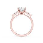 Rose gold ring with a diamond on a white background