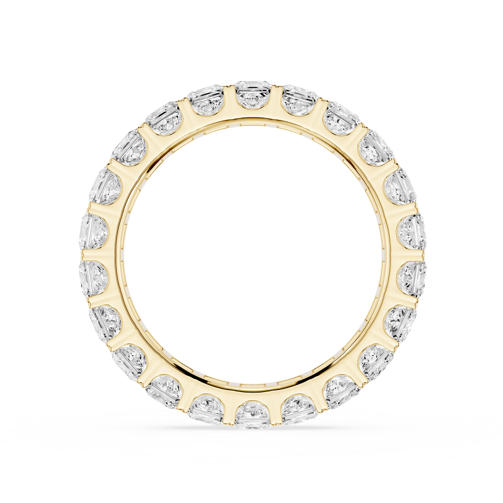 A yellow gold eternity ring set with round brilliant-cut diamonds, shown on a clean white background.