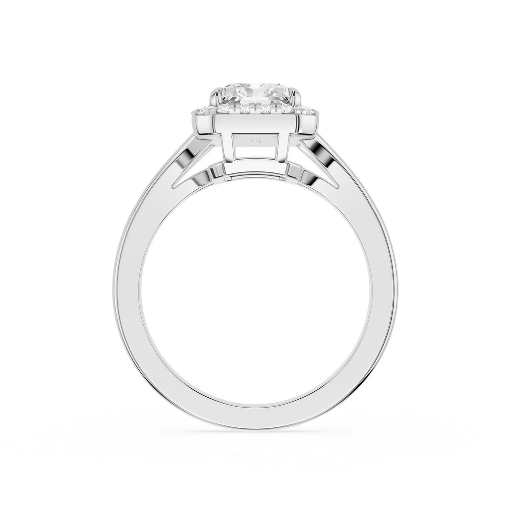 Silver ring with intricate design on a white background
