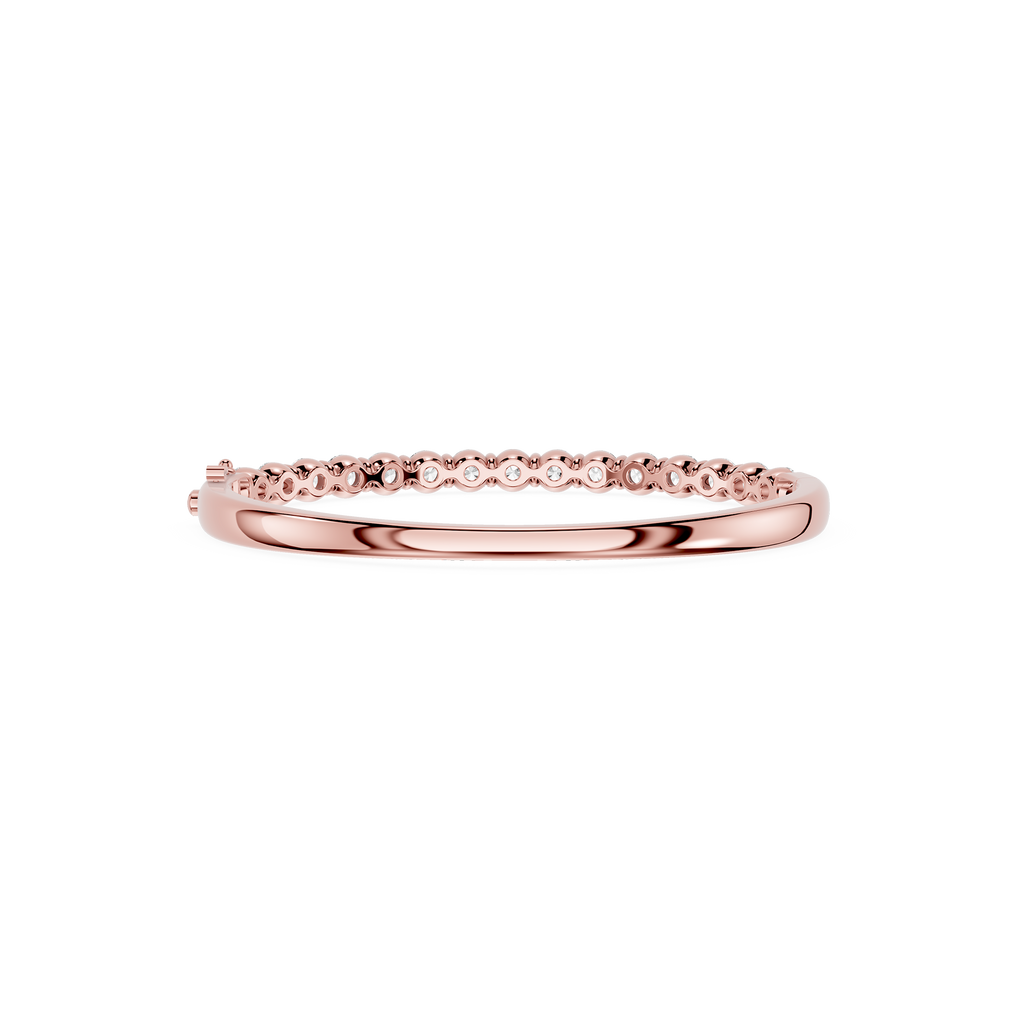 Rose gold ring with small diamonds on a white background