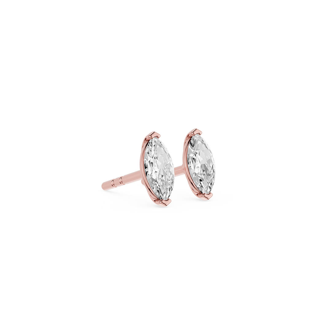 Rose gold earrings with clear gemstones on a white background
