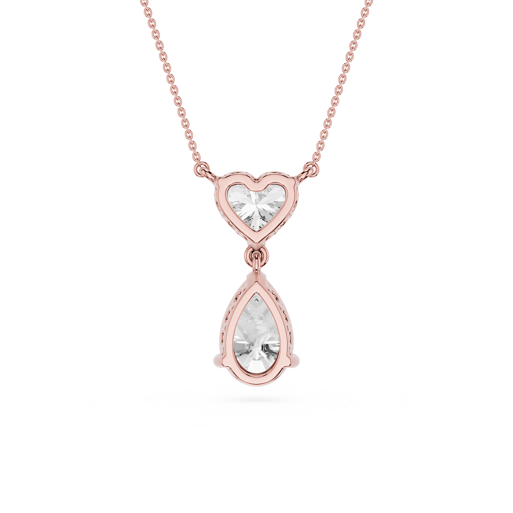 Rose gold necklace with heart and teardrop-shaped diamond pendants on a white background