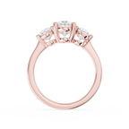 Three oval cut lab diamonds arranged in graduated sizes across a rose gold band with individual claw prong settings