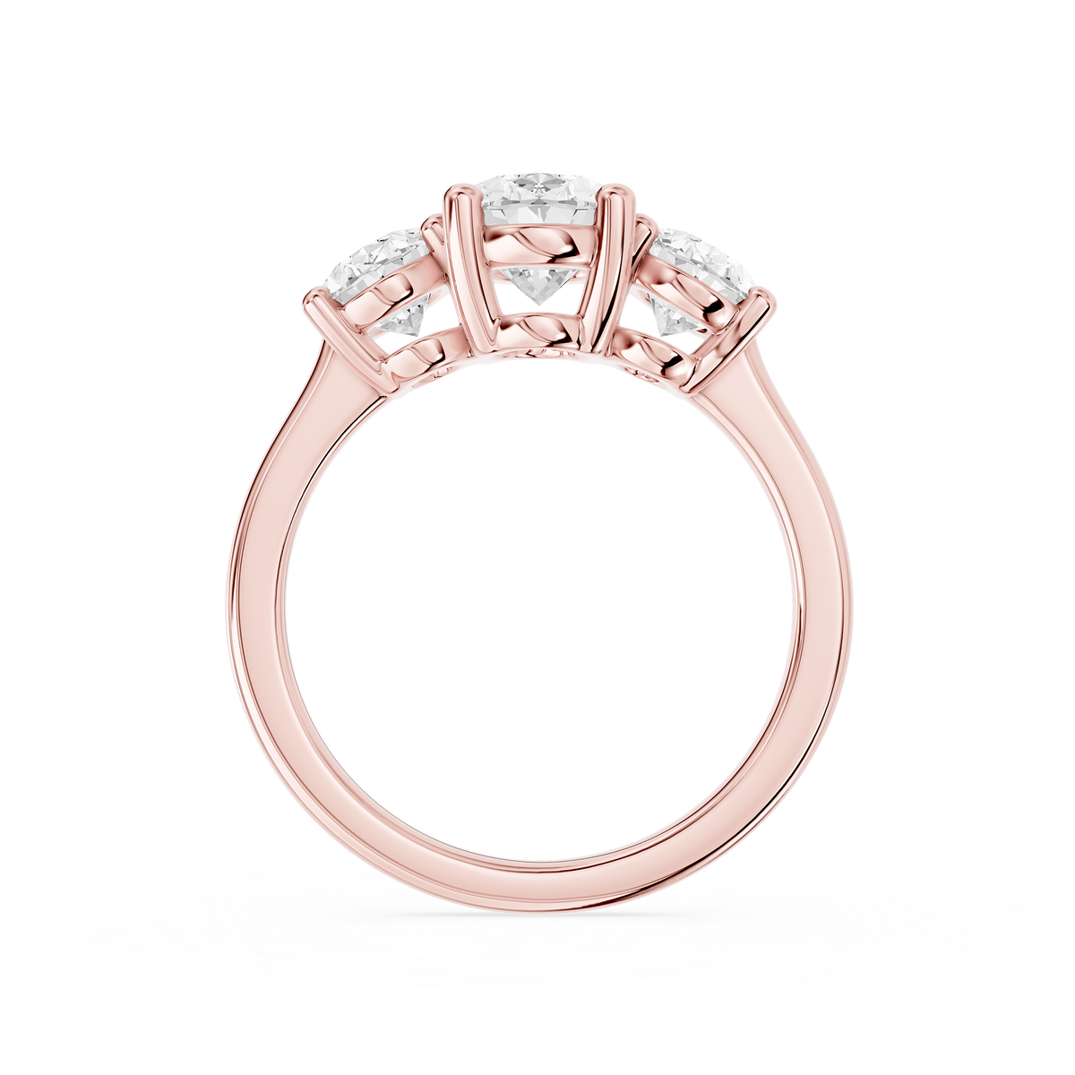 Three oval cut lab diamonds arranged in graduated sizes across a rose gold band with individual claw prong settings