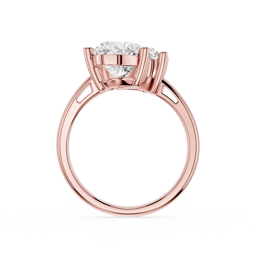 Rose gold solitaire engagement ring with a round brilliant-cut diamond center stone, shown on a clean white background.