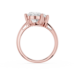 Rose gold solitaire engagement ring with a round brilliant-cut diamond center stone, shown on a clean white background.
