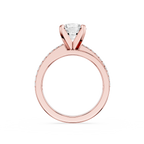 Rose gold ring with a diamond on a white background