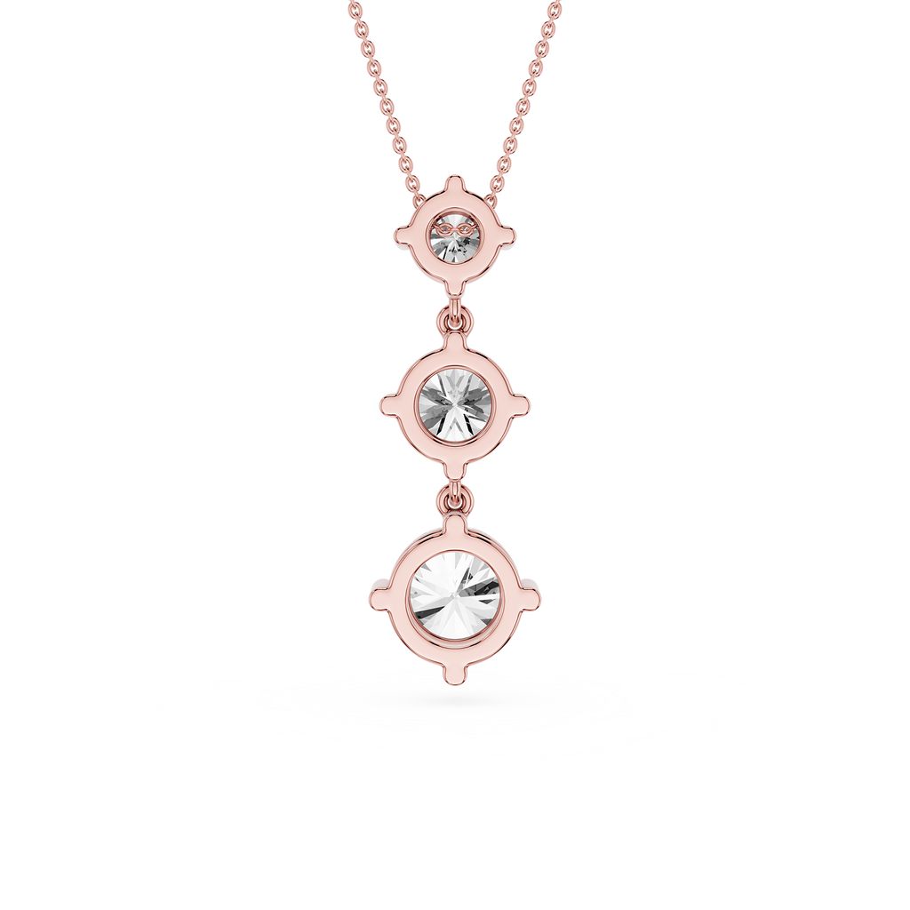 Rose gold necklace with three crystal stones on a white background