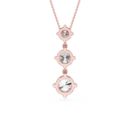 Rose gold necklace with three crystal stones on a white background