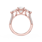 Rose gold ring with diamond accents on a white background