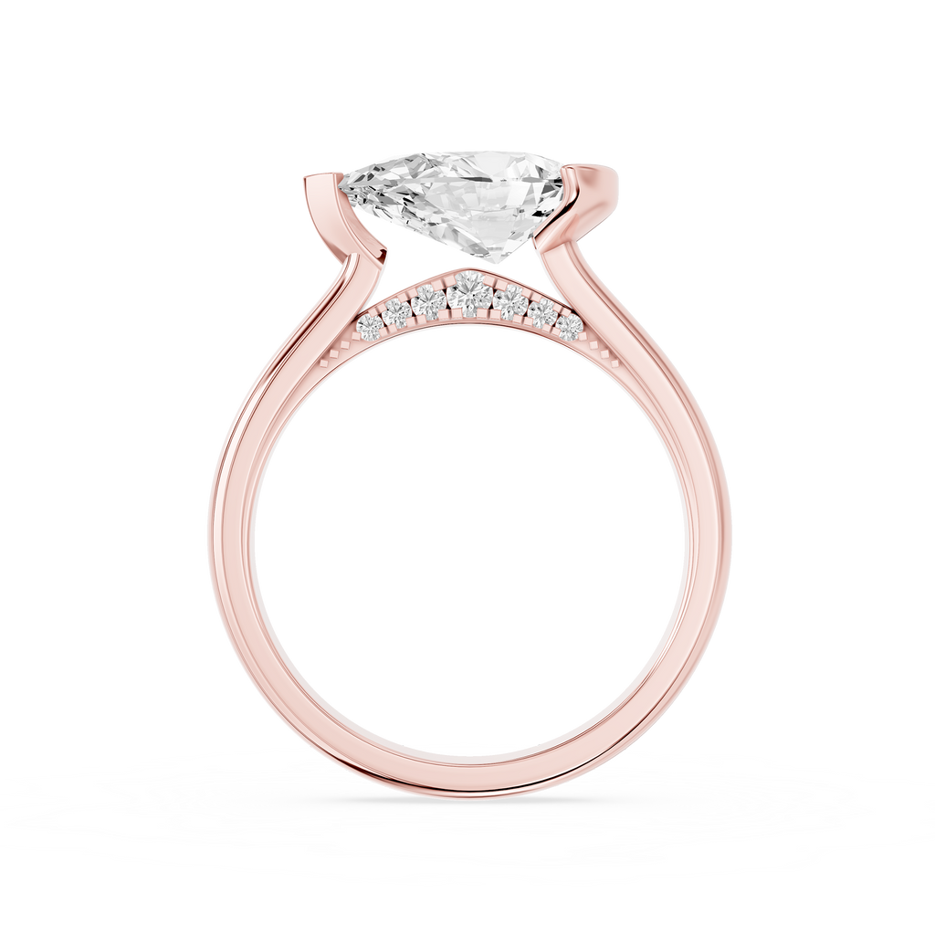 An asymmetrical half bezel secures the east west pear lab diamond on this rose gold ring with a smooth rounded shank