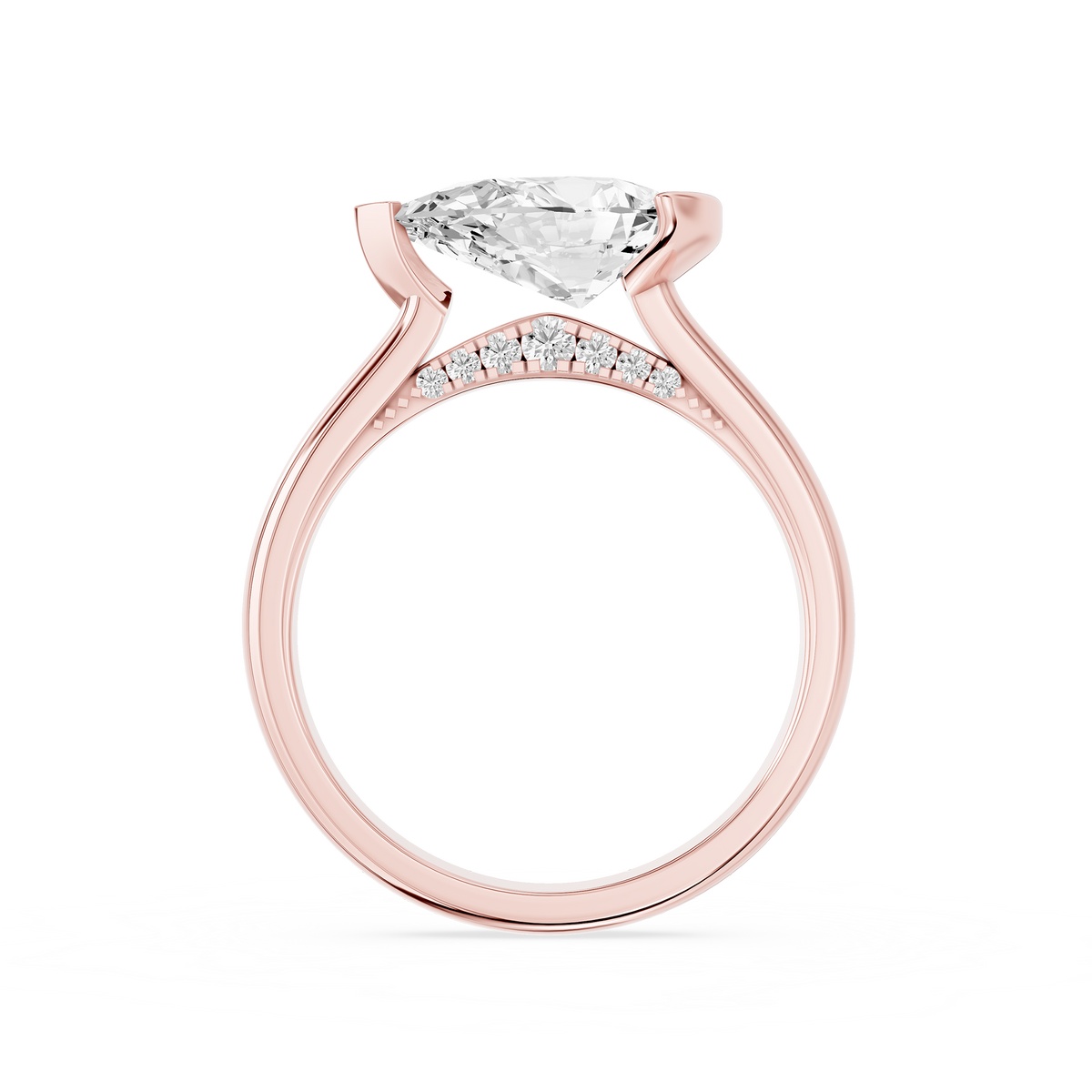 An asymmetrical half bezel secures the east west pear lab diamond on this rose gold ring with a smooth rounded shank