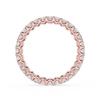 Rose gold ring with small diamonds on a white background