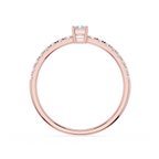 Rose gold ring with diamonds on a white background
