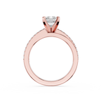 Rose gold ring with a diamond on a white background