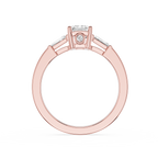 Rose gold ring with a diamond on a white background
