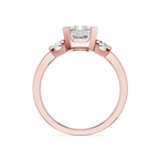 Rose gold ring with a diamond on a white background