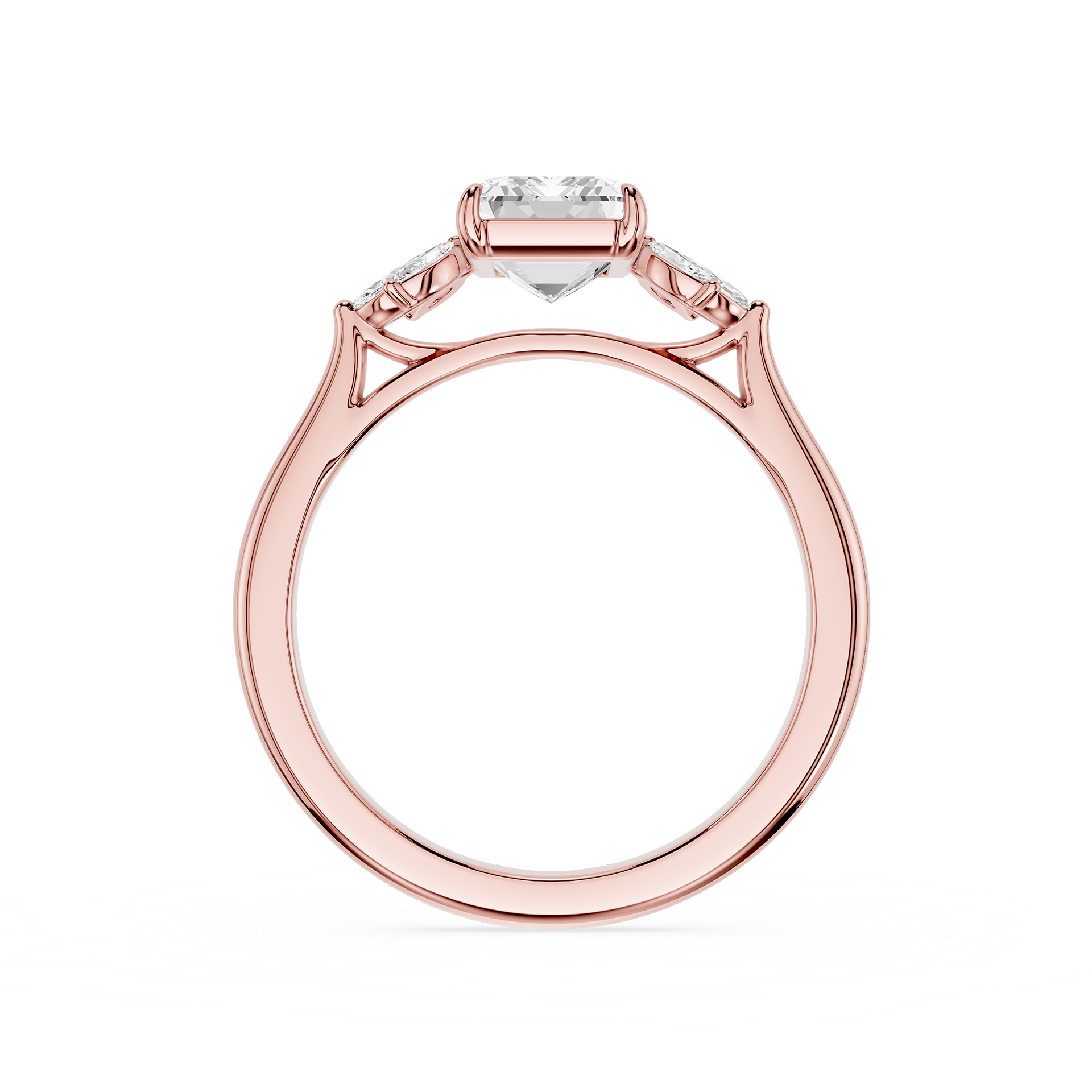 A rose gold ring with a heart-shaped clear gemstone in the center and smaller side stones, shown on a plain white background.
